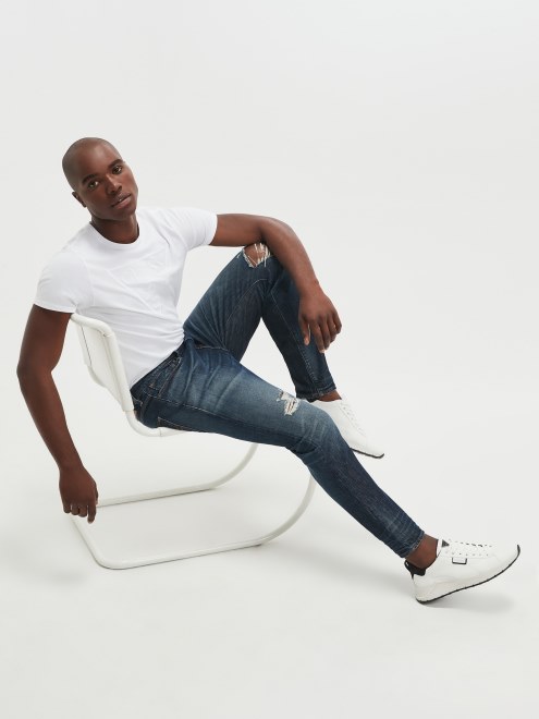 Vaqueros Tapered Holgados Con Diseño Envejecido De La Adivina Del Trotamundos